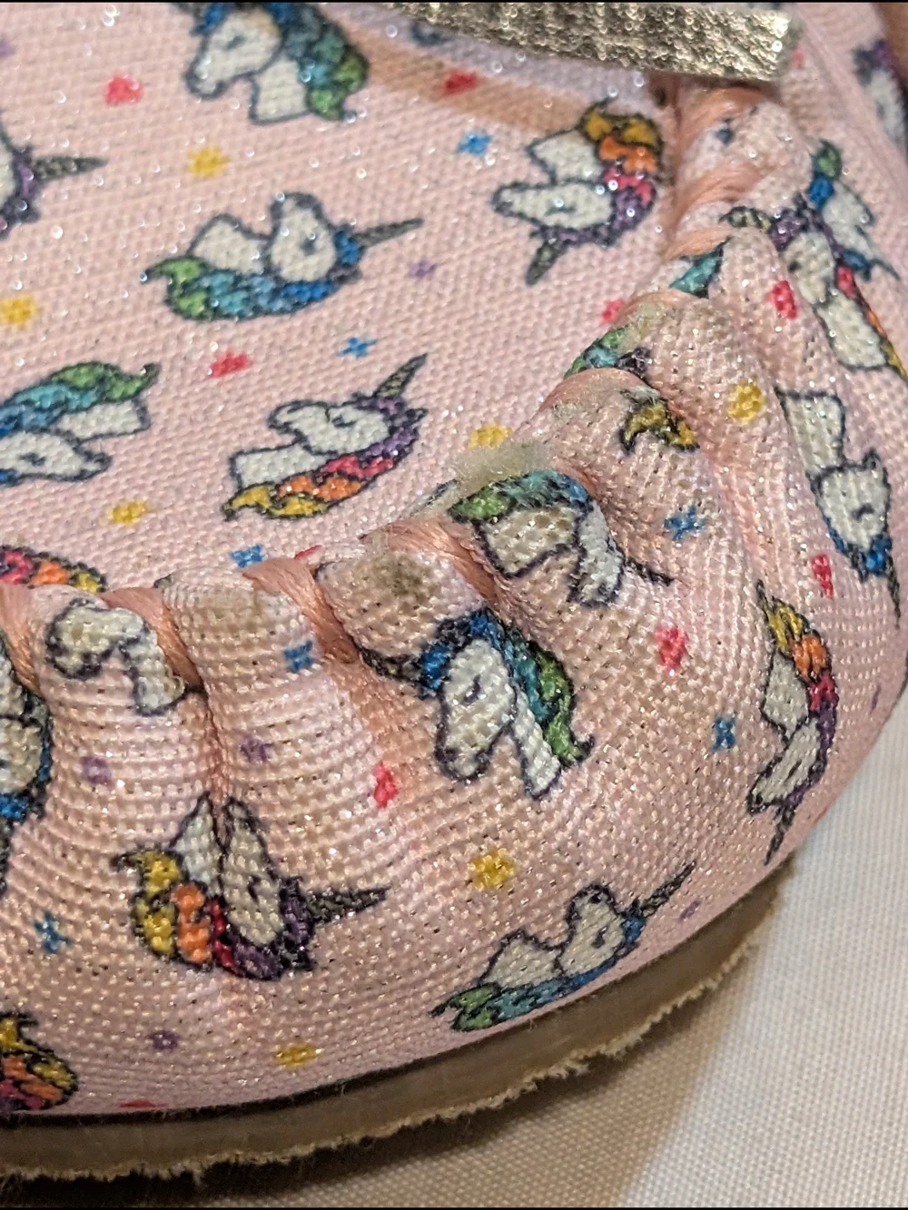 Minnetonka Pink Unicorn Print Moccasin Slippers with Silver Bow Accent